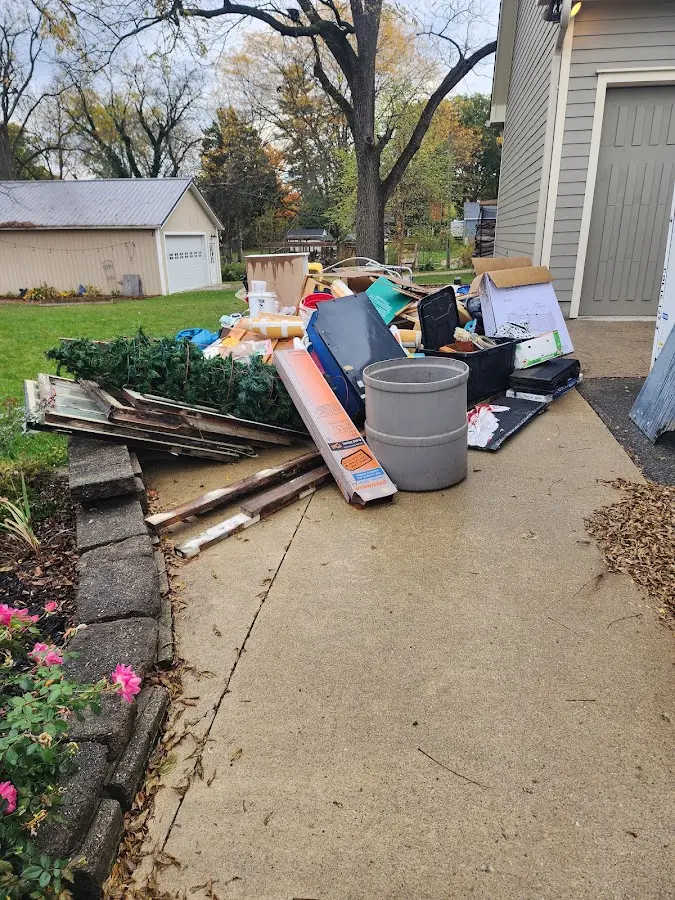 Dumpster being loaded with debris for 30 Yard Dumpster Rental in Fitchburg